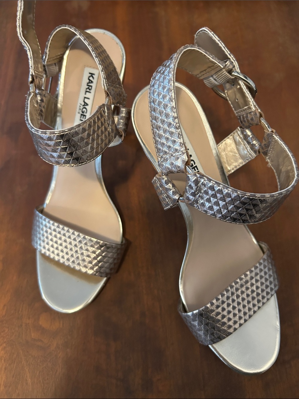 Karl Lagerfeld Metallic Silver Textured Ankle-Strap Heels. It’s a 4 inch heel